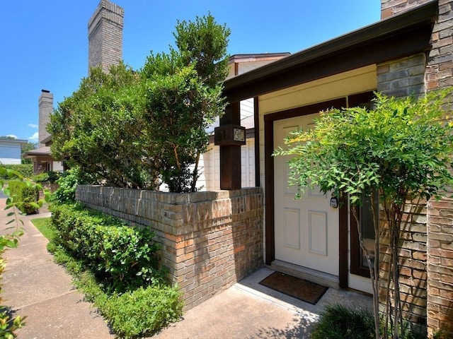 entrance to property with brick siding