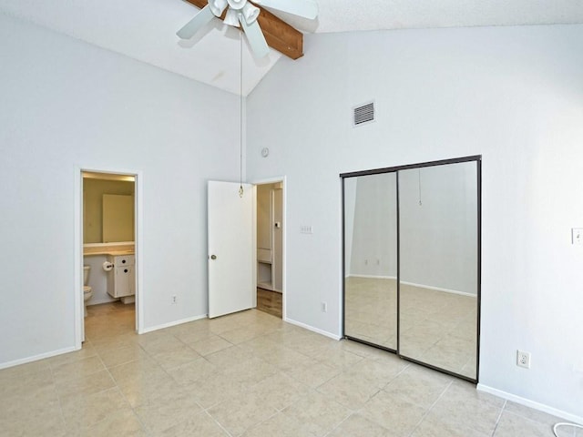 unfurnished bedroom featuring high vaulted ceiling, a closet, beam ceiling, visible vents, and light tile patterned flooring
