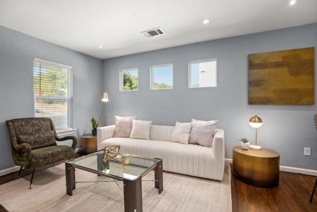 1183 Coleto St, Austin, TX 78702 - living area with baseboards, wood finished floors, and recessed lighting
