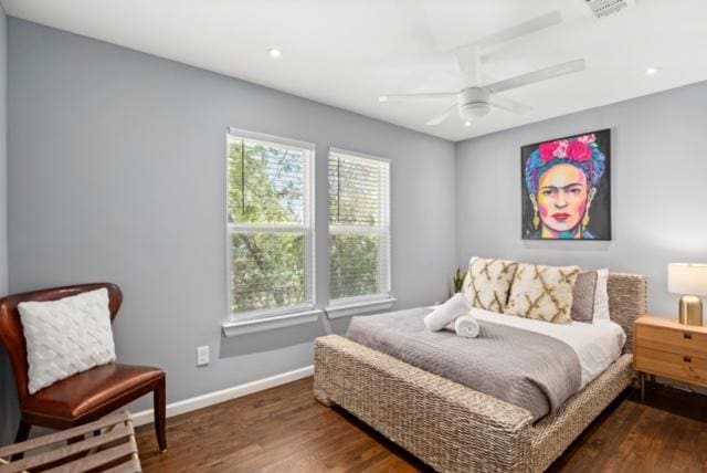 1183 Coleto St, Austin, TX 78702 - bedroom featuring multiple windows, wood finished floors, and baseboards