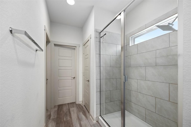 8220 Linnie Ln, Austin, TX 78724 - full bathroom with a shower stall and wood finished floors