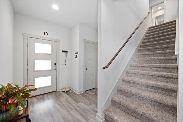 8220 Linnie Ln, Austin, TX 78724 - entrance foyer featuring stairs, wood finished floors, baseboards, and recessed lighting
