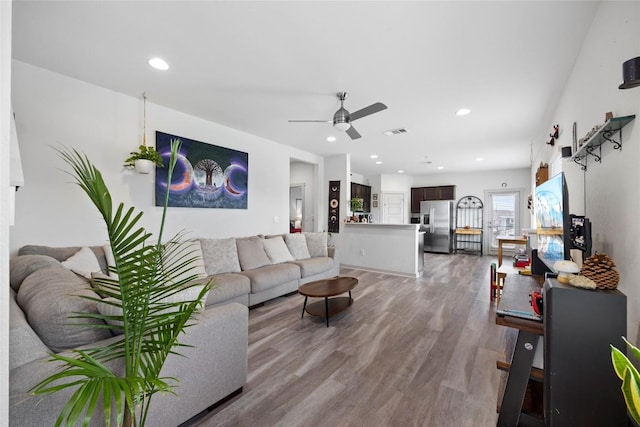 8220 Linnie Ln, Austin, TX 78724 - living room with a ceiling fan, light wood-style floors, and recessed lighting