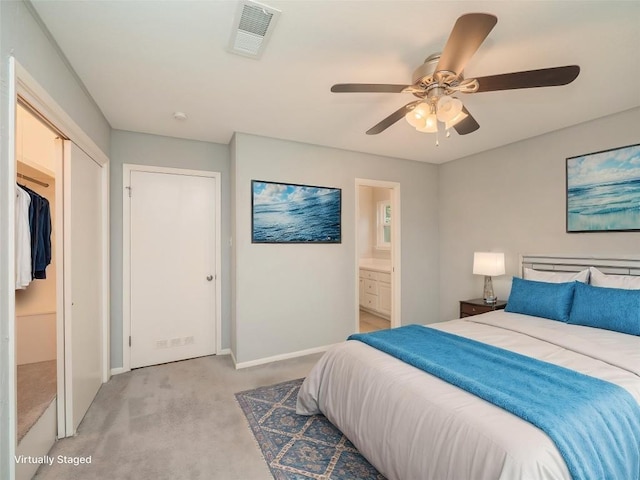 bedroom featuring ensuite bathroom, light colored carpet, visible vents, ceiling fan, and baseboards