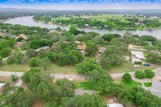 aerial perspective of suburban area featuring a nearby body of water