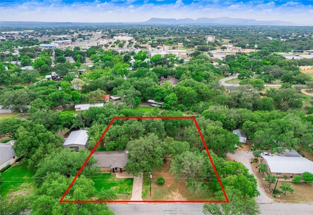 aerial view of property and surrounding area featuring property parcel outlined and mountains