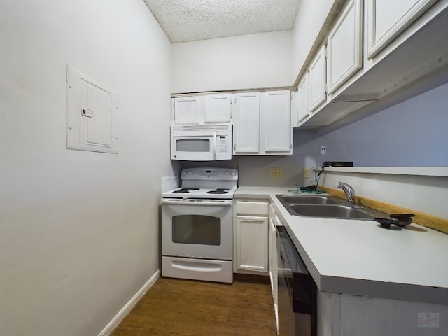 2901 San Jacinto Blvd Unit 105, Austin, TX 78705 - kitchen featuring baseboards, white appliances, a sink, electric panel, and dark wood-style floors