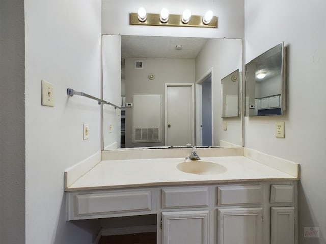 2901 San Jacinto Blvd Unit 105, Austin, TX 78705 - bathroom with visible vents and vanity