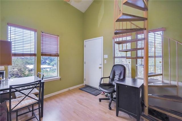 3115 Tom Green St Unit 404, Austin, TX 78705 - office space featuring wood finished floors, baseboards, and high vaulted ceiling