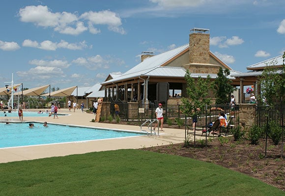 pool with fence and a patio area