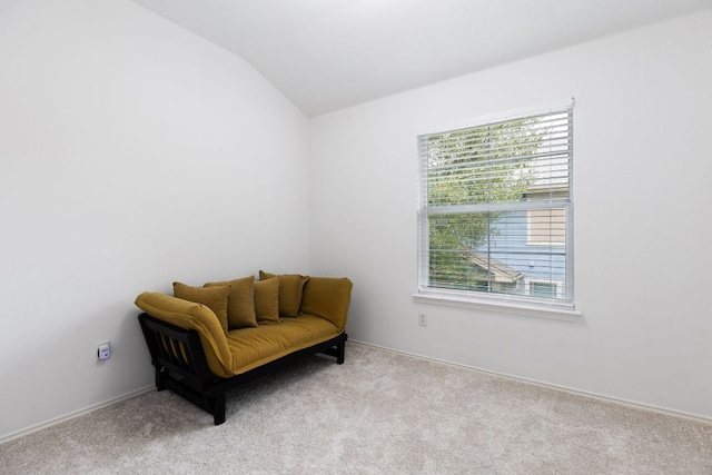 sitting room featuring baseboards, carpet, and vaulted ceiling