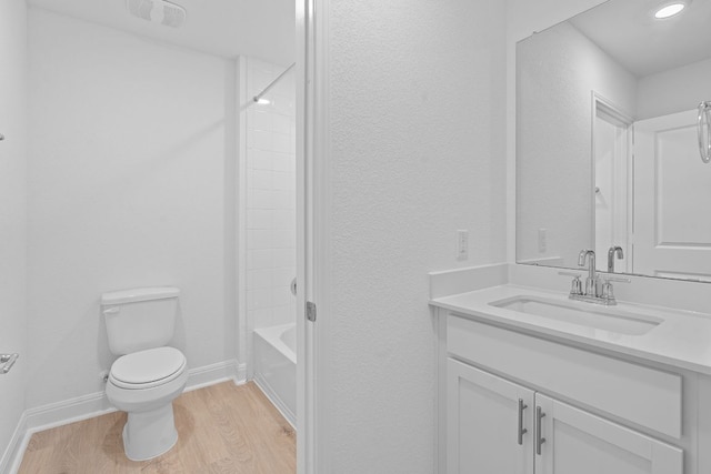 409 Rivers Edge Dr, Georgetown, TX 78628 - full bathroom with toilet, wood finished floors, vanity, recessed lighting, and baseboards