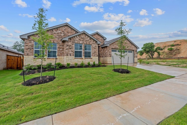 409 Rivers Edge Dr, Georgetown, TX 78628 - ranch-style home with driveway, a front lawn, fence, and a garage