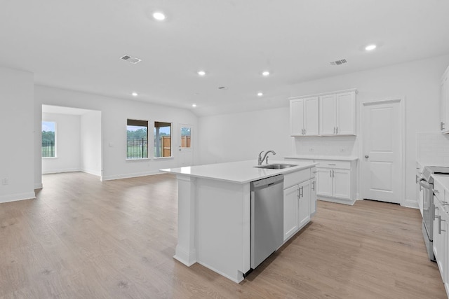 409 Rivers Edge Dr, Georgetown, TX 78628 - kitchen featuring a sink, recessed lighting, a kitchen island with sink, and appliances with stainless steel finishes