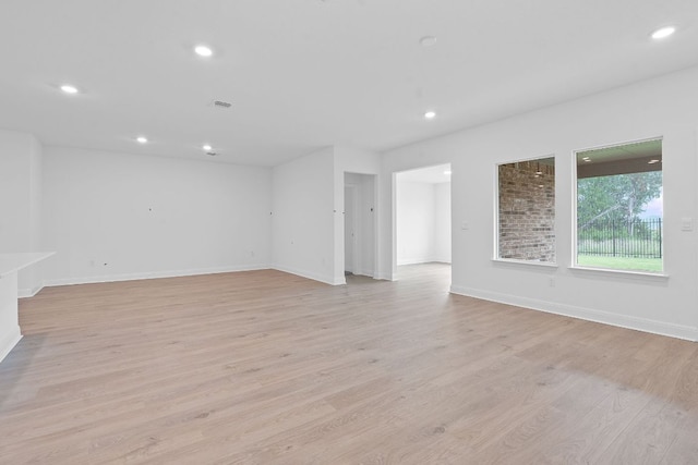 409 Rivers Edge Dr, Georgetown, TX 78628 - unfurnished room featuring light wood-style flooring, baseboards, and recessed lighting