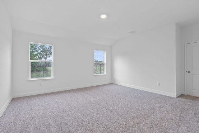 409 Rivers Edge Dr, Georgetown, TX 78628 - spare room featuring light carpet, visible vents, and a healthy amount of sunlight