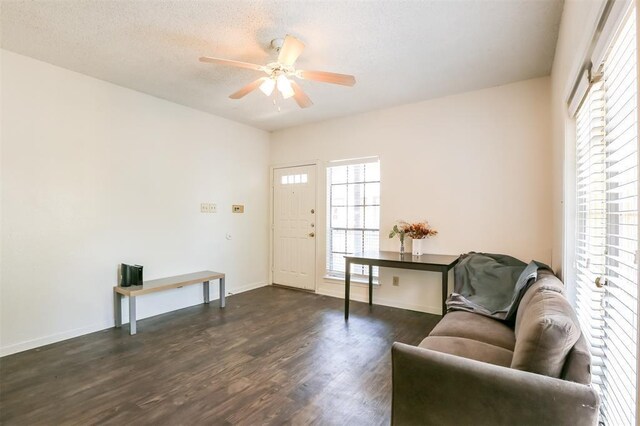 912 W 22nd St Unit 307, Austin, TX 78705 - sitting room with dark wood finished floors, ceiling fan, and baseboards