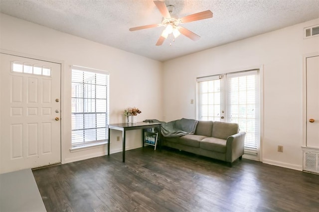 912 W 22nd St Unit 307, Austin, TX 78705 - entryway with dark wood-style flooring, a textured ceiling, a ceiling fan, and baseboards