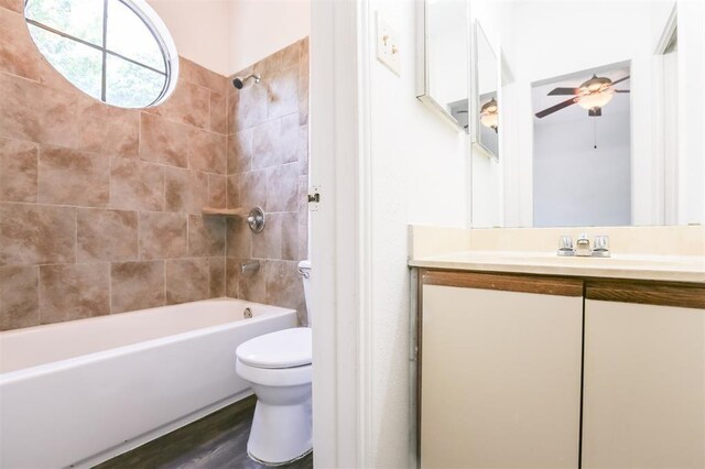 912 W 22nd St Unit 307, Austin, TX 78705 - full bath with toilet, vanity, ceiling fan, washtub / shower combination, and wood finished floors
