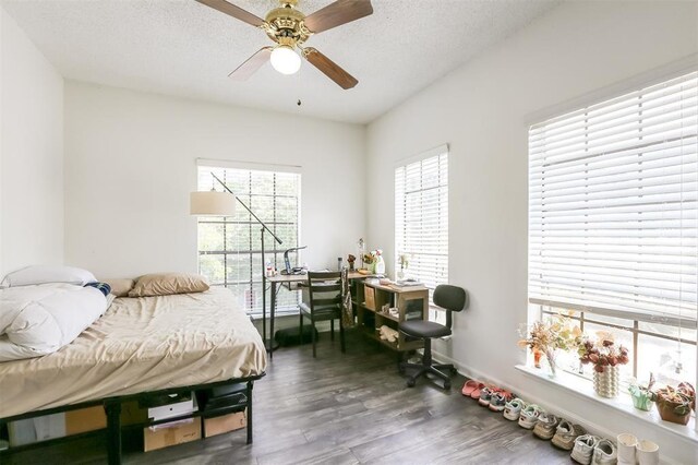 912 W 22nd St Unit 307, Austin, TX 78705 - bedroom featuring wood finished floors, ceiling fan, a textured ceiling, and baseboards
