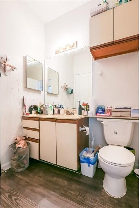 912 W 22nd St Unit 307, Austin, TX 78705 - bathroom featuring wood finished floors, vanity, and toilet