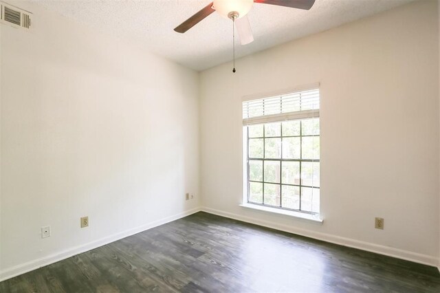 912 W 22nd St Unit 307, Austin, TX 78705 - empty room featuring dark wood-style floors, a ceiling fan, baseboards, and a textured ceiling