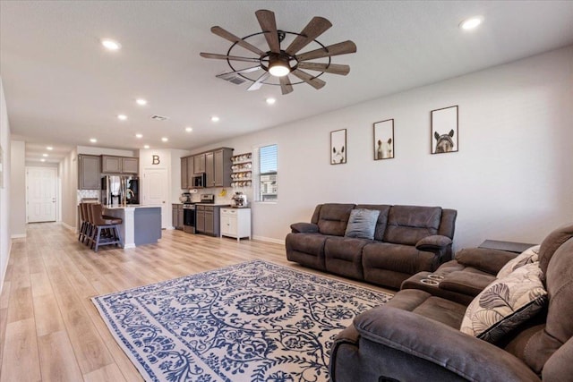 1001 Dog Iron St, Georgetown, TX 78633 - living area featuring ceiling fan, visible vents, light wood finished floors, and recessed lighting