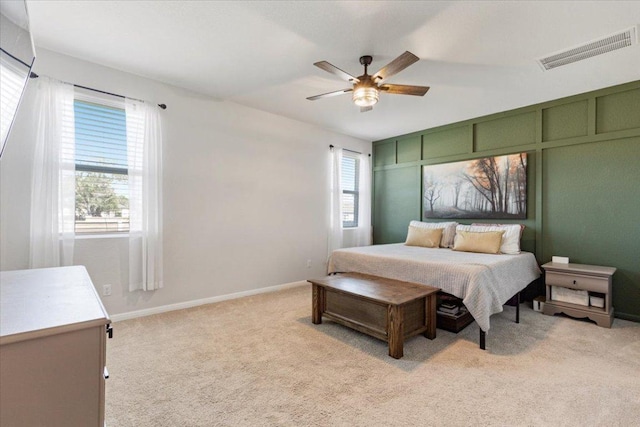 1001 Dog Iron St, Georgetown, TX 78633 - bedroom featuring baseboards, multiple windows, visible vents, and light colored carpet