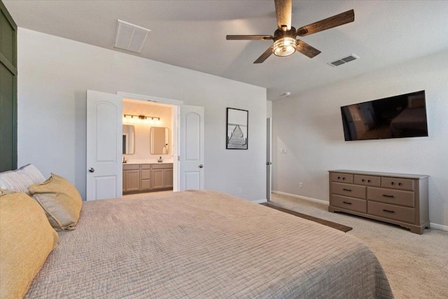 1001 Dog Iron St, Georgetown, TX 78633 - bedroom with ensuite bath, visible vents, baseboards, and carpet floors