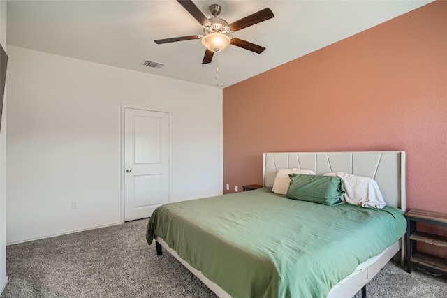 bedroom with carpet flooring, a ceiling fan, and visible vents