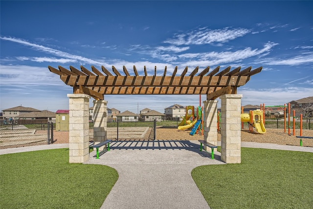view of patio featuring a pergola, playground community, and fence