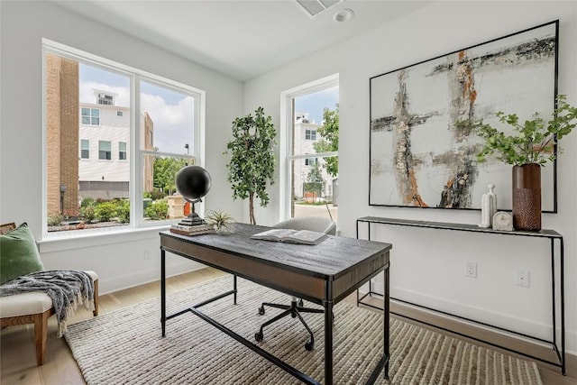 office space featuring wood finished floors and baseboards
