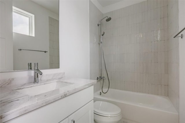 bathroom featuring toilet,  shower combination, and vanity