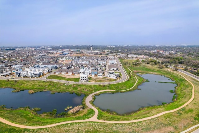bird's eye view featuring a water view and a residential view