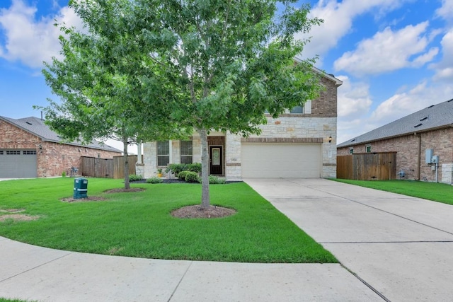 view of property hidden behind natural elements with stone siding, fence, a front lawn, and an attached garage