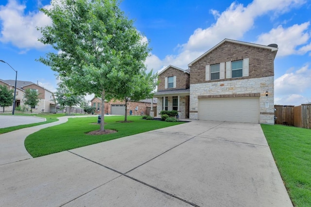 view of front of house featuring concrete driveway, an attached garage, a front lawn, and stone siding
