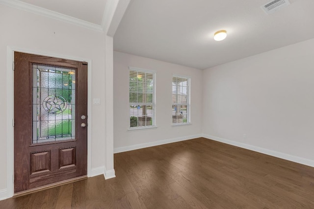 entryway with baseboards, a wealth of natural light, visible vents, and dark wood-style floors