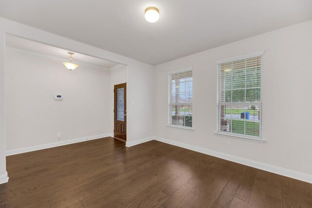 19612 Dunstan Beacon Ln, Pflugerville, TX 78660 - empty room featuring baseboards and dark wood-style floors