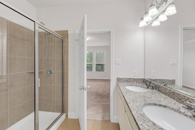 19612 Dunstan Beacon Ln, Pflugerville, TX 78660 - full bathroom featuring a stall shower, double vanity, and a chandelier