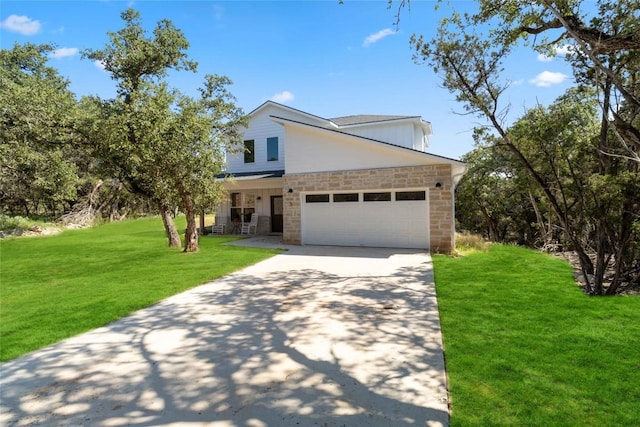 view of front of property with covered porch, stone siding, concrete driveway, a garage, and a front yard