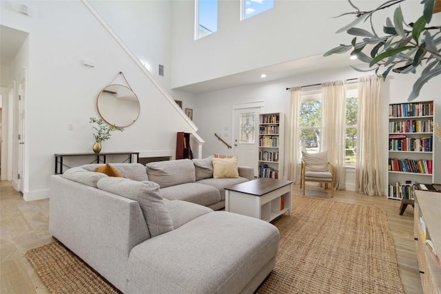 living area with stairway and plenty of natural light