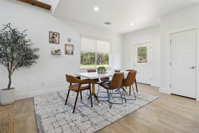 dining space with light wood-type flooring, visible vents, baseboards, and recessed lighting