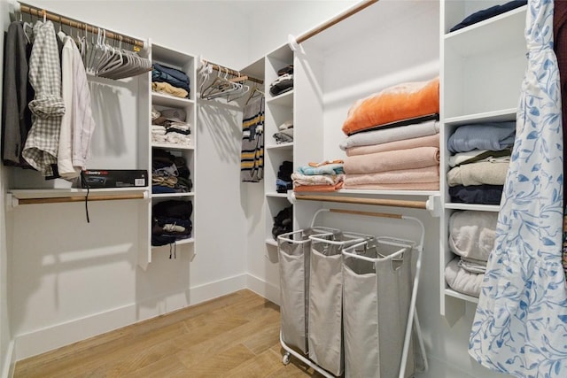 spacious closet featuring wood finished floors