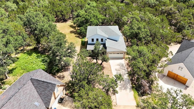 drone / aerial view featuring a view of trees
