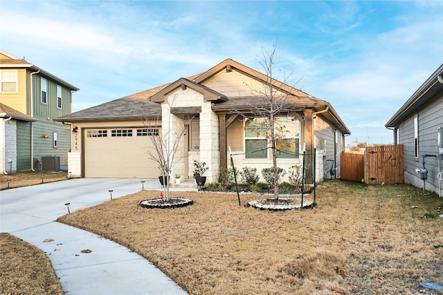 2945 Mill Run Bnd, Round Rock, TX 78665 - view of front of home with an attached garage, concrete driveway, and central air condition unit