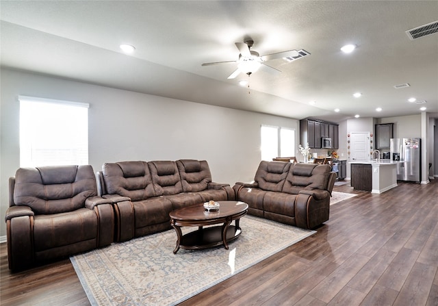 2945 Mill Run Bnd, Round Rock, TX 78665 - living area featuring a ceiling fan, dark wood finished floors, and recessed lighting