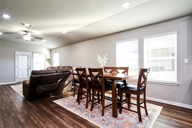 2945 Mill Run Bnd, Round Rock, TX 78665 - dining area featuring dark wood finished floors, healthy amount of natural light, a ceiling fan, baseboards, and vaulted ceiling