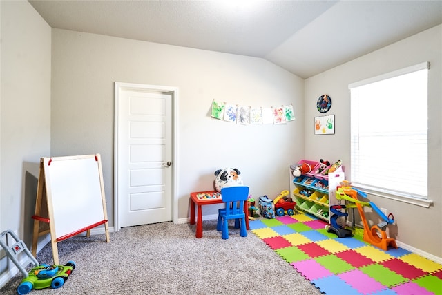 2945 Mill Run Bnd, Round Rock, TX 78665 - recreation room with vaulted ceiling, baseboards, and carpet flooring