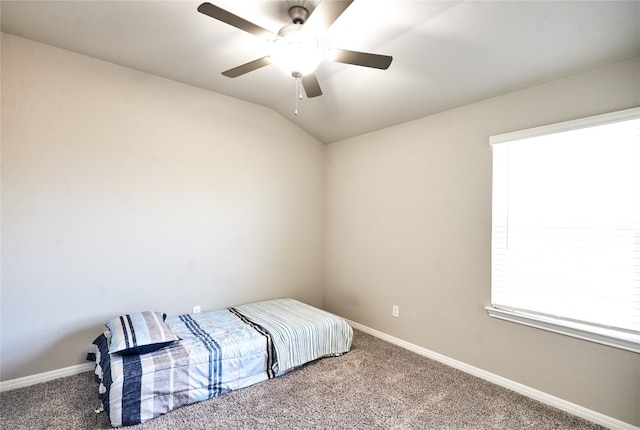 2945 Mill Run Bnd, Round Rock, TX 78665 - bedroom with carpet flooring, baseboards, a ceiling fan, and vaulted ceiling