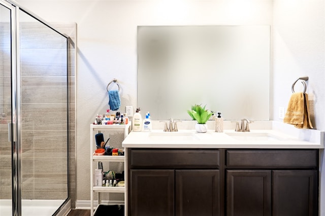 2945 Mill Run Bnd, Round Rock, TX 78665 - full bath featuring a stall shower, double vanity, and wood finished floors